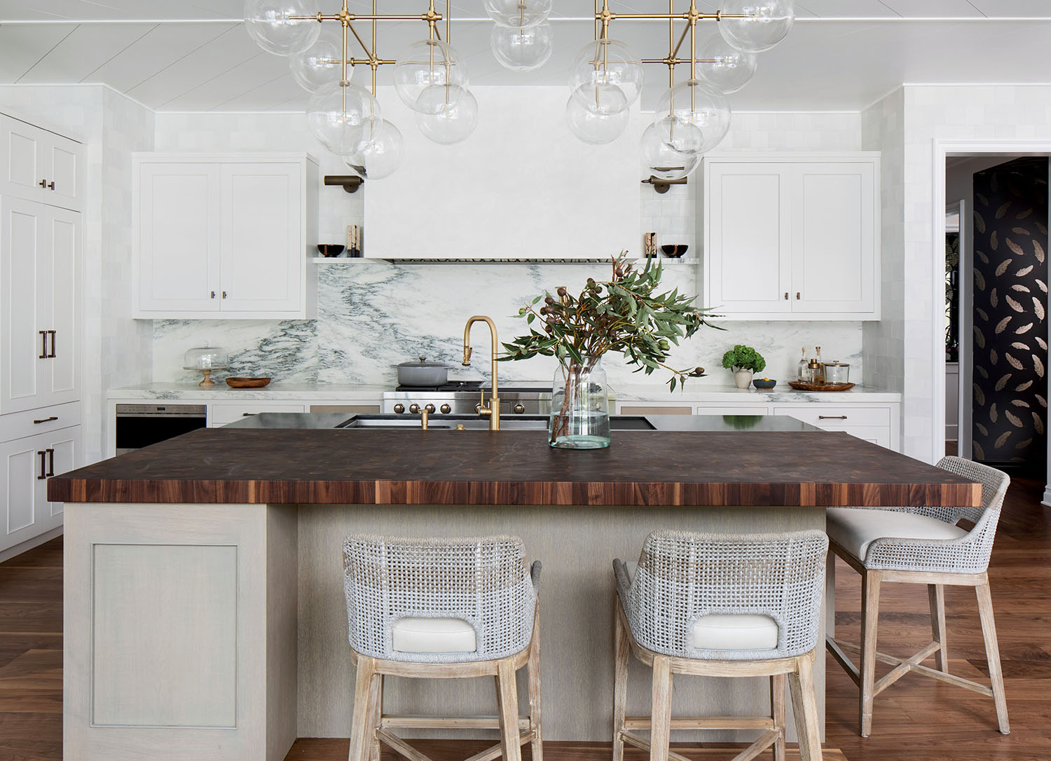 A kitchen with white cabinets